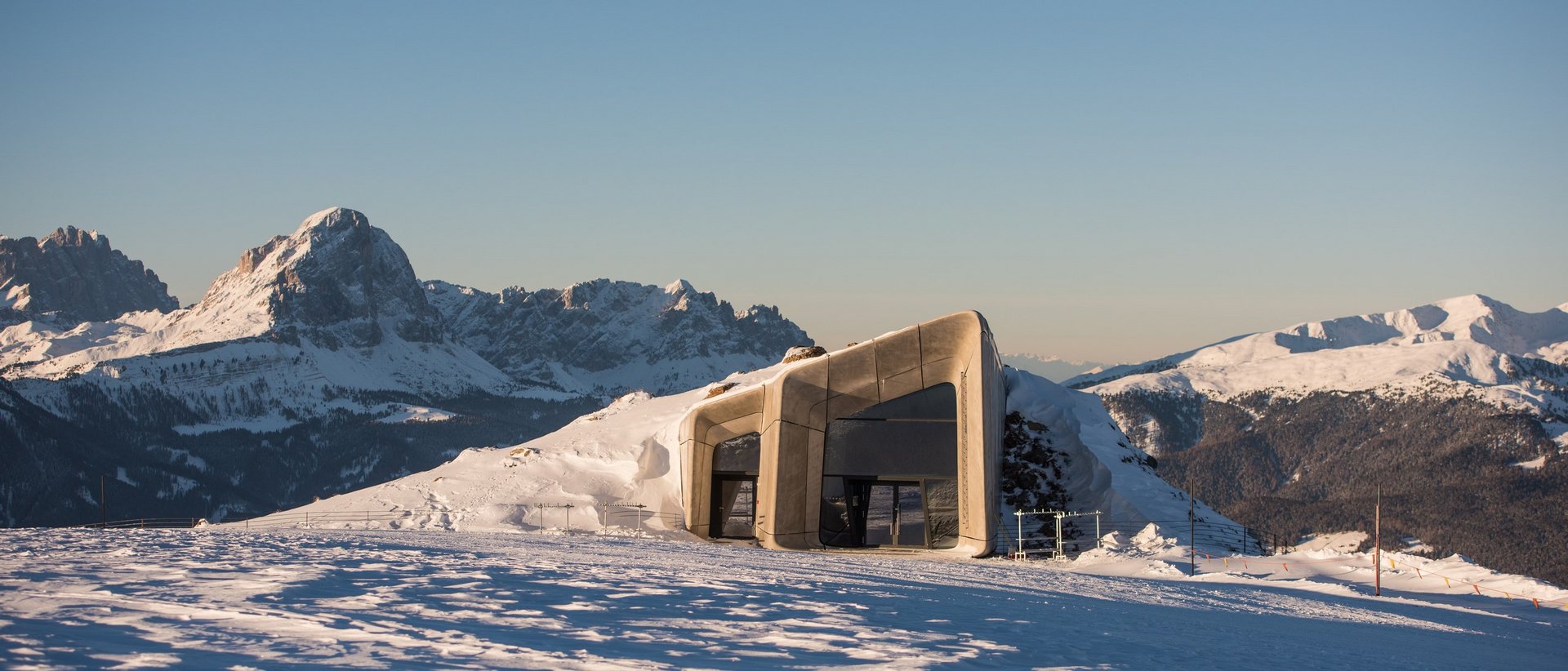 The best hotel at Plan de Corones/Kronplatz Snow-covered modern building in the mountains under clear sky