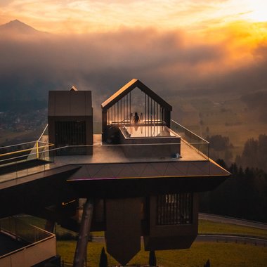 Certified quality for you Modern balcony with seating area and glass railing at sunset