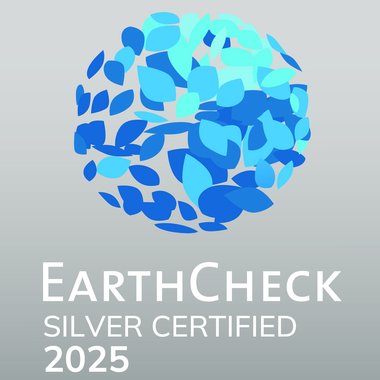 Certified quality for you EarthCheck Silver Certified 2025 with blue leaf logo on gray background