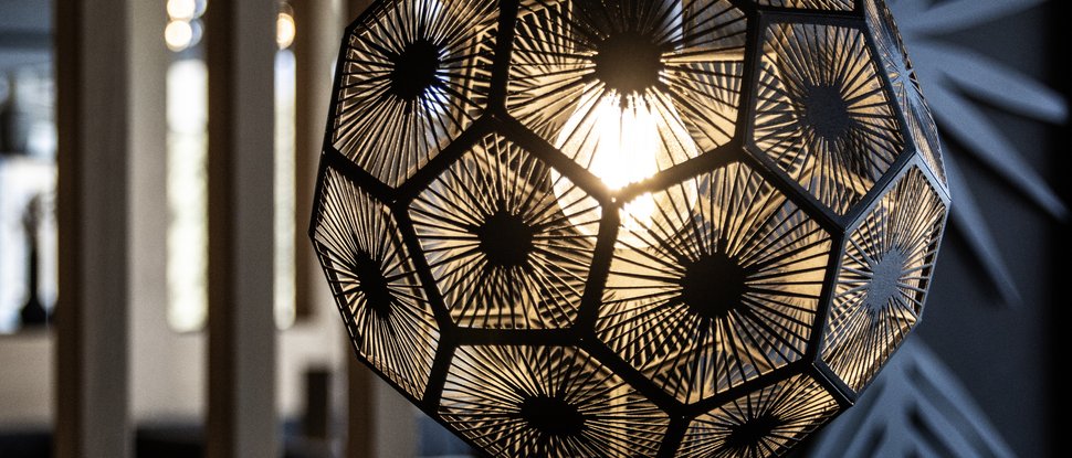Our current catalogue for downloading Modern pendant light with geometric pattern in a dark room