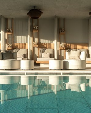 Our wellness hotel in Val Pusteria for relaxation seekers Bright lounge area with pool and comfortable modern seating