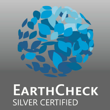 Awards & Press EarthCheck Silver certified logo with blue leaves on grey background