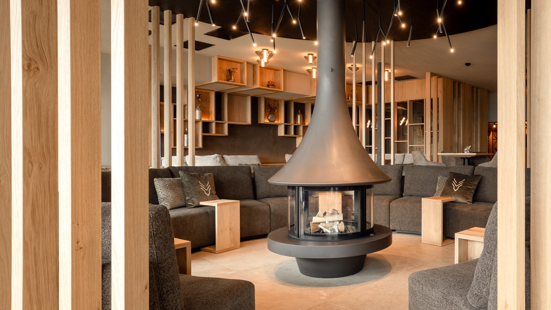 A place to enjoy Modern lounge area with fireplace and gray sofas