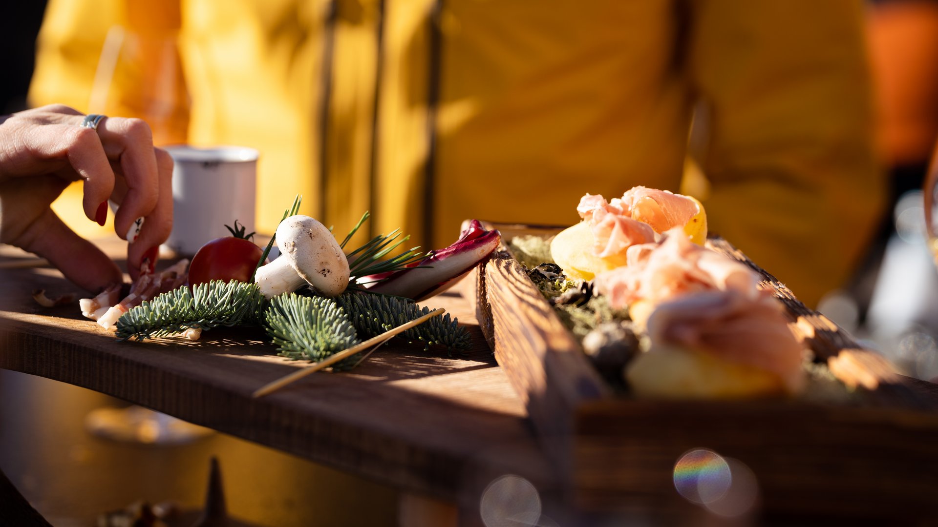 The best hotel at Plan de Corones/Kronplatz Various small dishes and vegetables served on a wooden board